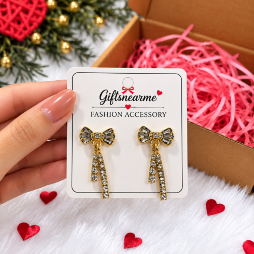 Golden Bow Sparkle Earrings displayed on a GiftsNearMe gift card