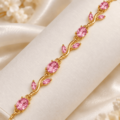 Close-up of pink oval stones and leaf-shaped accents in Rosy Vine Bracelet