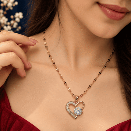 Sparkle Heart Necklace with a gold-tone open heart and clear stones worn by a woman