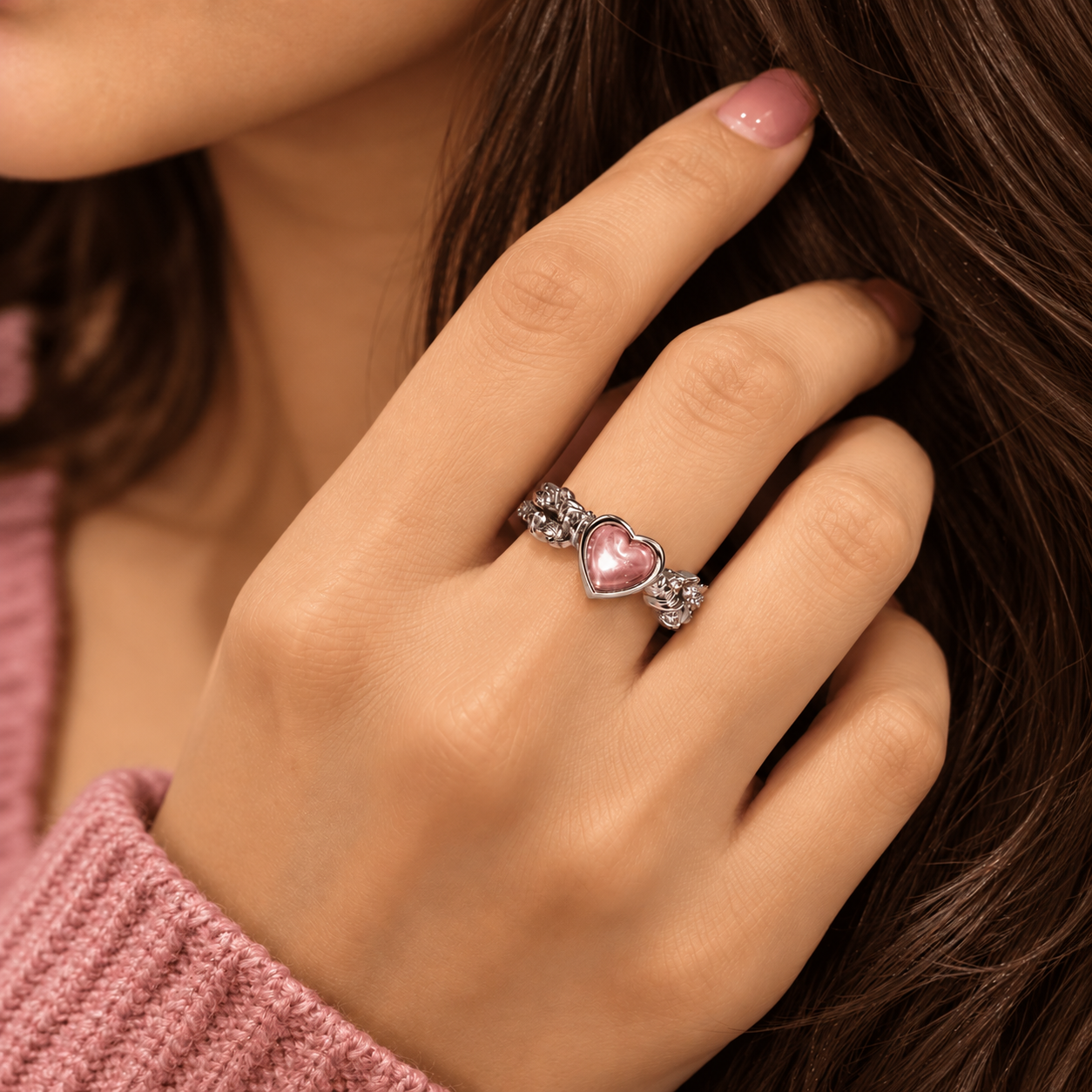 Vintage Heart Ring Worn on Finger Silver-tone ornate floral ring with a smooth pink heart centre worn on a finger